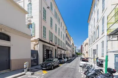 a city street with parked cars and buildings at MY CASA - DELOYE - Spacious Quiet studio w AC near Old Town in Nice