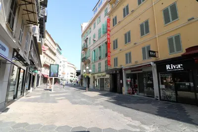 an empty street in a city with buildings at Spacieux Duplex - Zone Piétonne in Nice