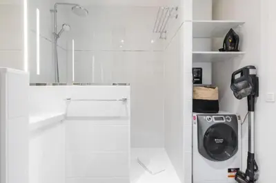 a white laundry room with a washer and dryer at MY CASA - MOULIN - Stunning 1 bedroom Apt on the Port in Nice