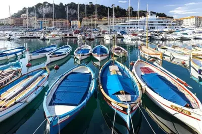 a group of boats docked in a marina at MY CASA - MOULIN - Stunning 1 bedroom Apt on the Port in Nice