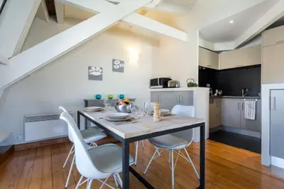 a kitchen and dining room with a table and chairs at MY CASA - ETATS UNIS 896 - Magic view rooftop terrace in Nice