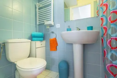 a bathroom with a toilet and a sink at MY CASA - PORT 1 - Spacious and central w AC on the Port in Nice