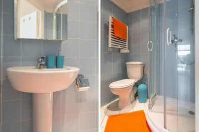 a bathroom with a sink and a toilet and a shower at MY CASA - PORT 2 - Spacious and central w AC on the Port in Nice