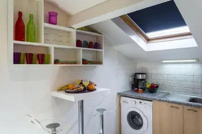 a kitchen with a sink and a washing machine at MY CASA - PORT 3 - Spacious and central w AC on the Port in Nice