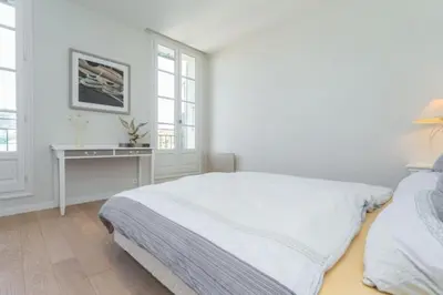 a white bedroom with a bed and a desk at MY CASA - JEAN JAURES - 90m2 w AC 2min to Beach in Nice