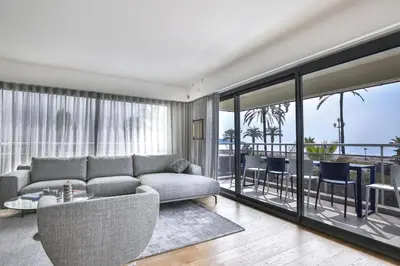 a living room with a couch and a balcony at Sublime Appartement Promenade des Anglais (1) in Nice