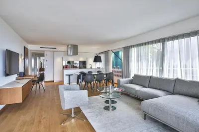 a living room with a couch and a table at Sublime Appartement Promenade des Anglais (1) in Nice