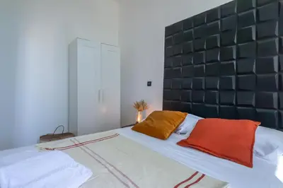 a bed with two pillows on it in a room at 301a Charming 2 rooms refurbished super center in Nice