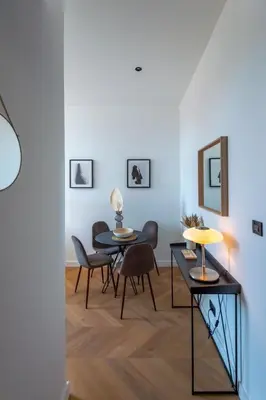 a dining room with two tables and chairs at 301a Charming 2 rooms refurbished super center in Nice