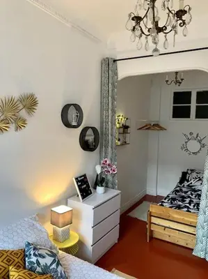 a bedroom with a bed and a dresser in it at Magenta - T2 Au Cœur Du Carré D'or De Nice in Nice