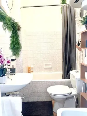 a bathroom with a white toilet and a sink at Magenta - T2 Au Cœur Du Carré D'or De Nice in Nice
