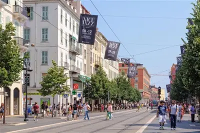 a group of people walking down a city street at Magenta - T2 Au Cœur Du Carré D'or De Nice in Nice