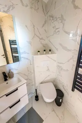 a bathroom with a toilet and a sink at 304 B Charming apartment refurbished super in Nice