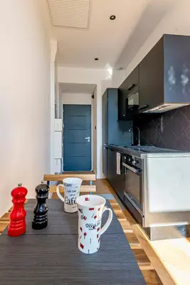 a kitchen with two coffee mugs on a table at 304 B Charming apartment refurbished super in Nice