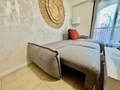 a bedroom with a bed with a ceiling fan at ⁂ Charmant 2 pièces centre-ville avec parking in Cagnes-sur-Mer