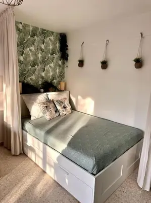 a bedroom with a bed in a room at Orangers - Bord de mer - Studio cosy 4 personnes in Cagnes-sur-Mer
