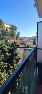 a balcony with a view of a river and buildings at F1 - 8MIN DE LA PLAGE - 5MIN TRAMWAY in Nice