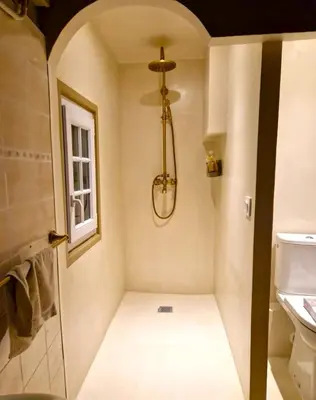 a bathroom with a shower and a toilet and a window at Heart of Vieux Nice Beach & Saleya in Nice