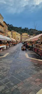 a street with a market with fruits and vegetables at Heart of Vieux Nice Beach & Saleya in Nice