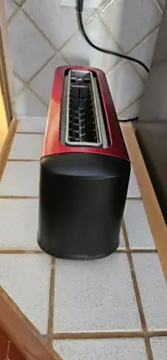 a red and black appliance sitting on the floor at Heart of Vieux Nice Beach & Saleya in Nice