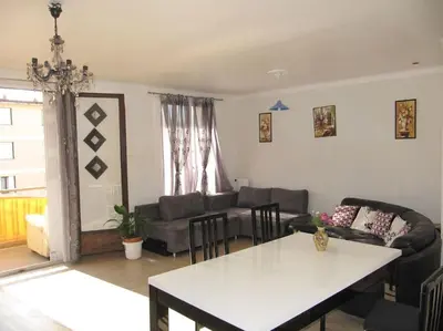a living room with a couch and a table at Appartement à 50 mètres de la plage in Cagnes-sur-Mer