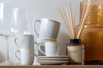 a group of white cups and plates and a wine glass at Unique Old Town Designer Studio in Nice