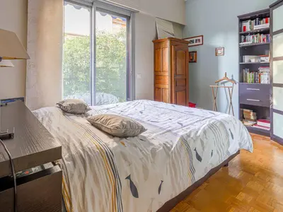 a bedroom with a bed with two pillows on it at Apartment Terrasses de la Baie des Anges by Interhome in Nice