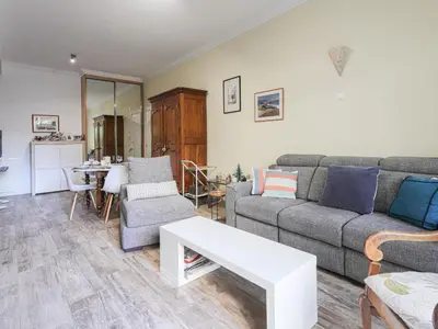 a living room with a couch and a table at Apartment Terrasses de la Baie des Anges by Interhome in Nice