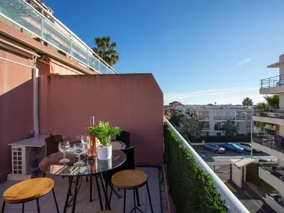 a patio with a table and chairs on a balcony at Apartment Villa Emeraude by Interhome in Cagnes-sur-Mer