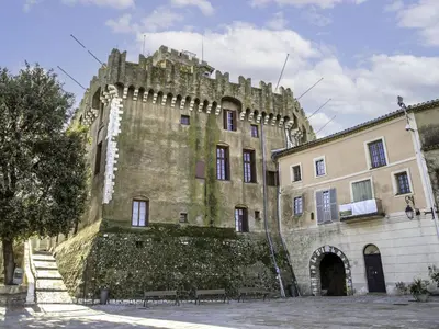 an old building with a stone wall next to a building at Apartment Villa Emeraude by Interhome in Cagnes-sur-Mer