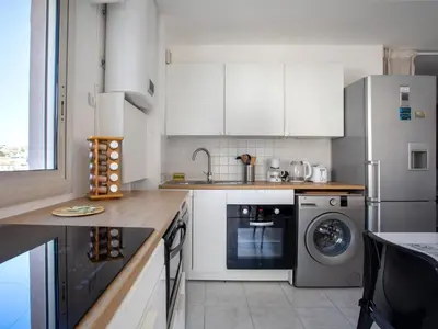 a kitchen with a refrigerator and a washing machine at Apartment Villa Emeraude by Interhome in Cagnes-sur-Mer
