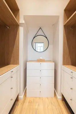 a dressing room with white dressers and a mirror at Magnifique 2P avec vue sur le port de Nice in Nice