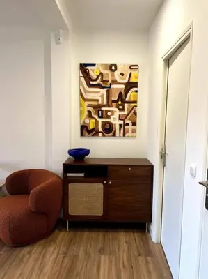 a room with a chair and a painting on the wall at EZE Roc (Monaco) in Èze