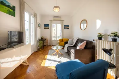 a living room with a couch and a tv at * Le Provençal * cosy flat 3 min walk from the sea in Nice