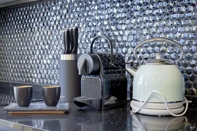 a kitchen counter with a tea kettle and cups at Luxury apartment in City Center of Nice in Nice