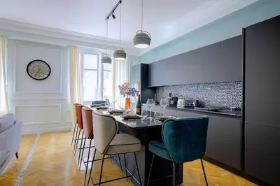 a kitchen with a table and chairs in a room at Luxury apartment in City Center of Nice in Nice