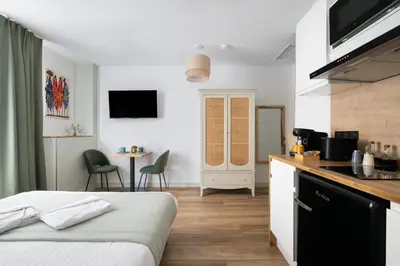 a hotel room with a bed and a kitchen at App-Art in Nice
