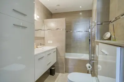 a bathroom with a toilet and a sink and a shower at Sublime, modern, balconies, a/c, refurbished in Nice