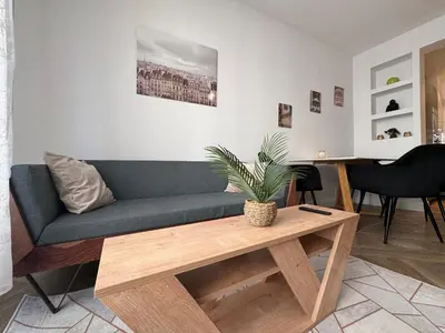 a living room with a couch and a coffee table at Oscar in Nice
