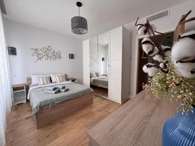 a bedroom with a bed and a large mirror at Oscar in Nice