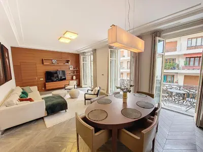 a living room with a table and a couch at Nestor&Jeeves - VICTOIRE - Central - Near Beach in Nice
