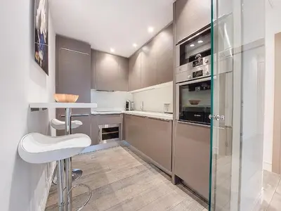 a kitchen with stainless steel appliances and a counter at Nestor&Jeeves - VICTOIRE - Central - Near Beach in Nice