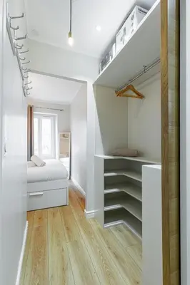 a bedroom with white walls and a bed and stairs at Lovely 1 Bdr Port Area in Nice
