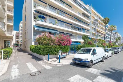 a white van parked in front of a building at Promenade des Anglais 2 Bdr Large Terrace in Nice