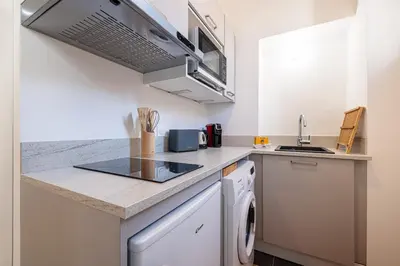 a kitchen with a sink and a dishwasher at Charming City Center Studio 104 in Nice