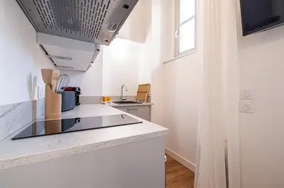 a kitchen with a sink and a counter top at Charming City Center Studio 104 in Nice