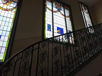 a staircase with stained glass windows in a building at Riviera Cocoon - Nice Center in Nice