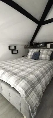 a bedroom with a bed with a checkered blanket at Riviera Cocoon - Nice Center in Nice