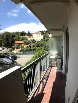 a balcony of a building with a view of a street at Nice bas Cimiez- Coquet F1, climatisée, Parking in Nice