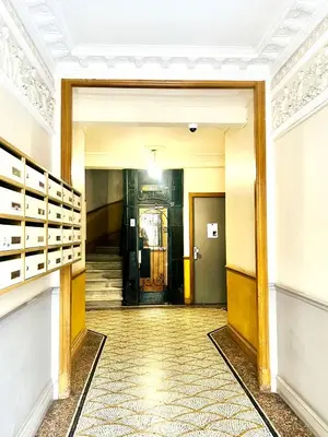 a hallway with a door in a building at Cœur d'Azur Appartement in Nice